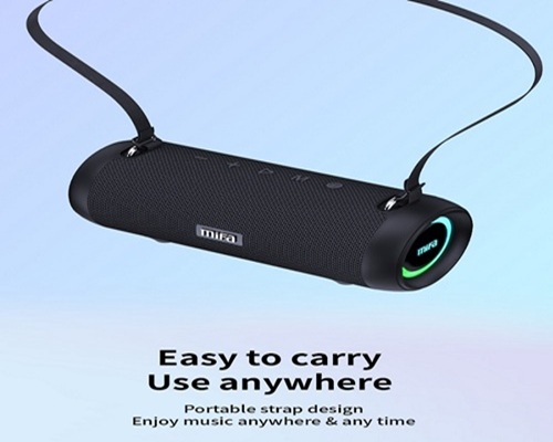 Mifa A90 speaker suspended from a black carrying strap. A colored ring with the MIFA logo lights up on the right end of the speaker. Below it is the text “Easy to carry Use anywhere” and “Portable strap design.