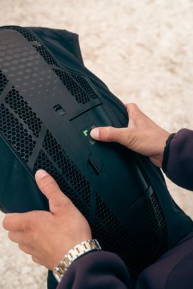 Hands operate the sensor of the airbag module of the Horse Pilot E-Twist'Air vest. Hands operate the sensor of the airbag module of the Horse Pilot E-Twist'Air vest.